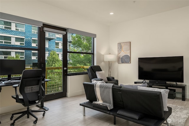 office space with light hardwood / wood-style flooring