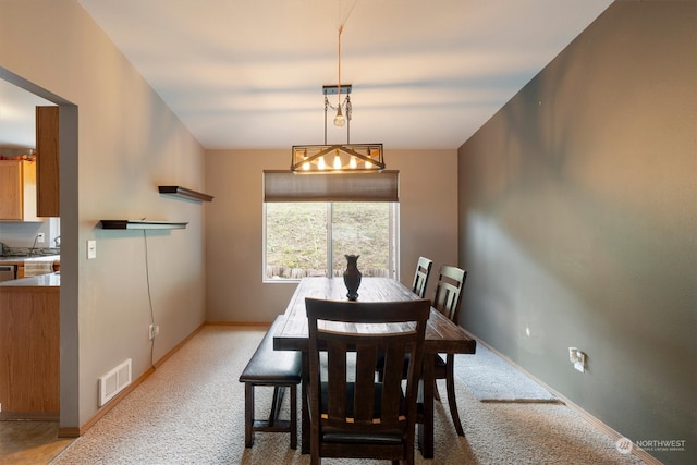 view of carpeted dining space