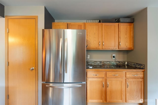 kitchen featuring stainless steel refrigerator