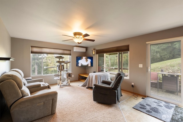 living room with ceiling fan and an AC wall unit