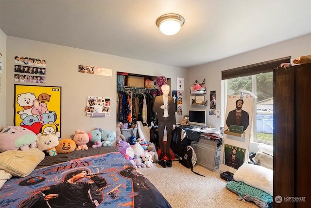 bedroom with carpet and a closet