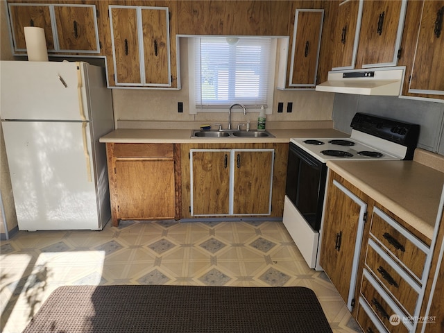 kitchen with sink and white appliances