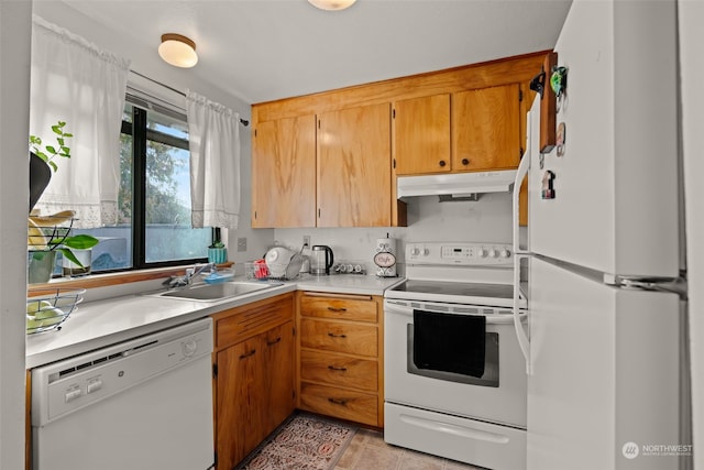 kitchen with sink and white appliances