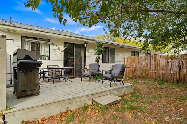 wooden deck featuring area for grilling