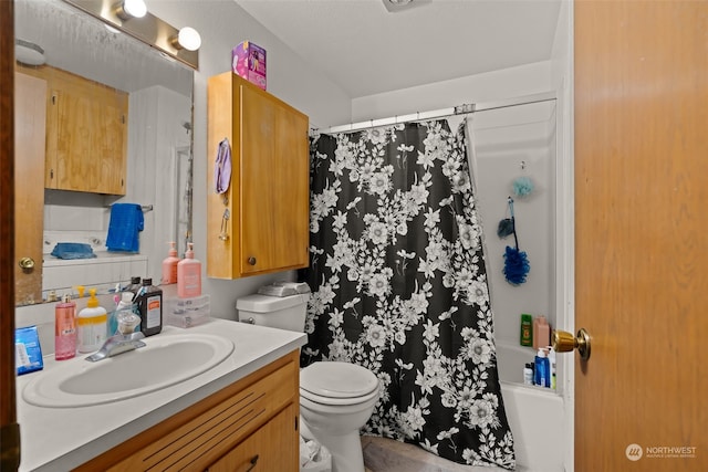 full bathroom featuring vanity, toilet, and shower / bathtub combination with curtain