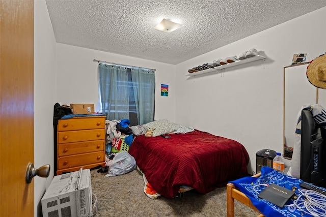 carpeted bedroom with a textured ceiling