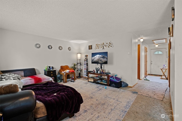 living room featuring light carpet and a textured ceiling