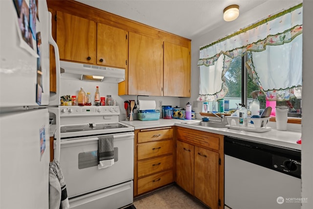 kitchen with sink and white appliances