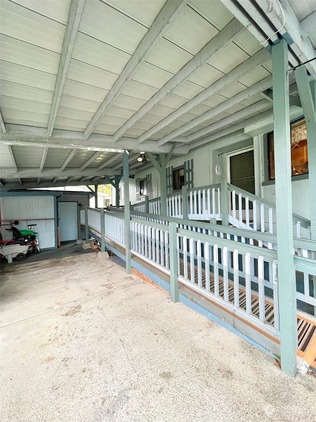 view of side of property featuring a carport