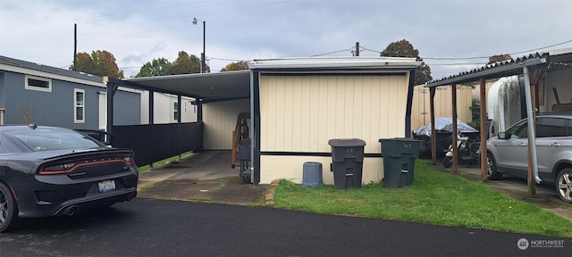 view of home's exterior with a carport