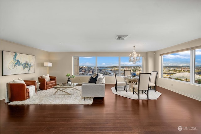 3201 Pacific Ave Unit 1201, Tacoma, WA 98418 - living area with dark wood-style flooring, a chandelier, and baseboards