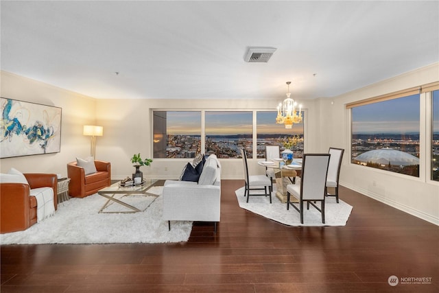 3201 Pacific Ave Unit 1201, Tacoma, WA 98418 - living room with a chandelier, wood finished floors, and baseboards