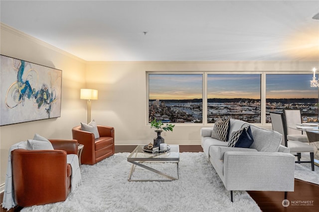 3201 Pacific Ave Unit 1201, Tacoma, WA 98418 - living area with a chandelier, crown molding, wood finished floors, and baseboards
