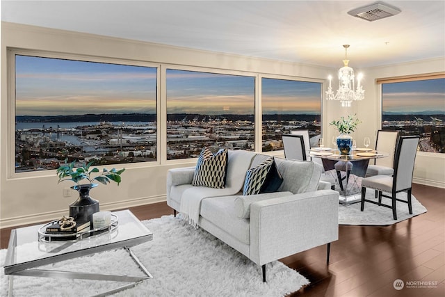 3201 Pacific Ave Unit 1201, Tacoma, WA 98418 - living room featuring wood finished floors, a chandelier, and baseboards