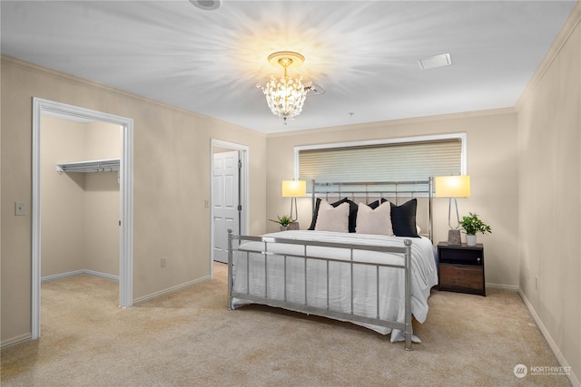 3201 Pacific Ave Unit 1201, Tacoma, WA 98418 - carpeted bedroom with a chandelier, ornamental molding, a walk in closet, and baseboards