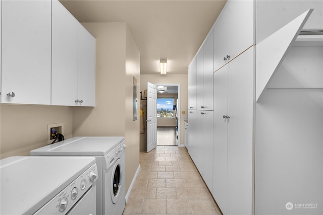 laundry area featuring cabinets and separate washer and dryer