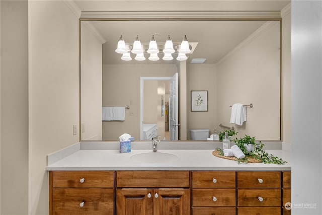 bathroom featuring vanity, toilet, and crown molding