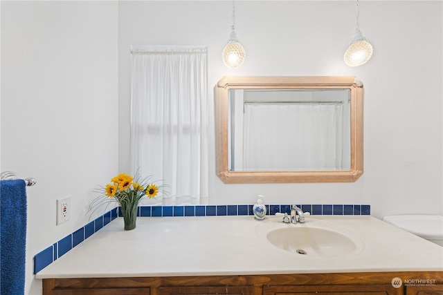 bathroom with vanity and toilet