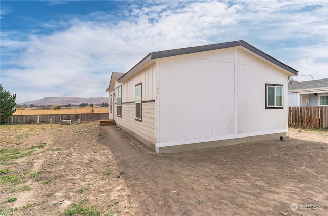 view of home's exterior featuring a mountain view