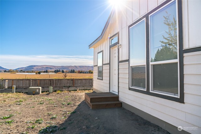 view of side of property with a mountain view