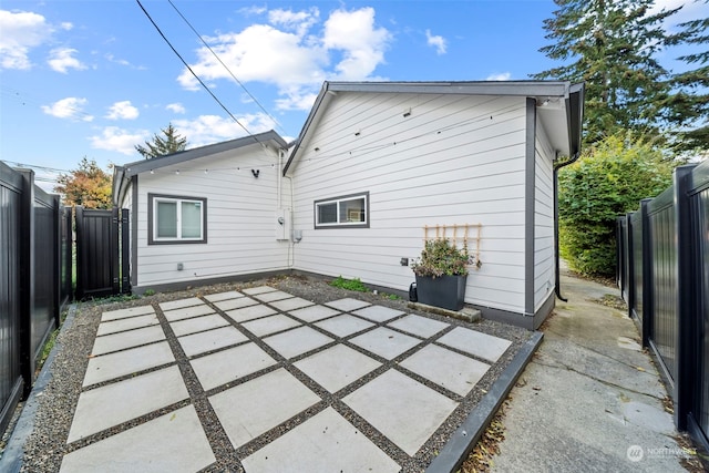 rear view of property featuring a patio