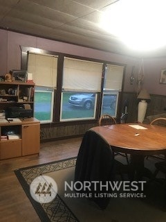 dining space with hardwood / wood-style floors