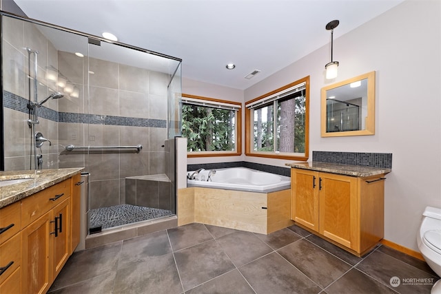 full bathroom with vanity, toilet, tile patterned floors, and shower with separate bathtub