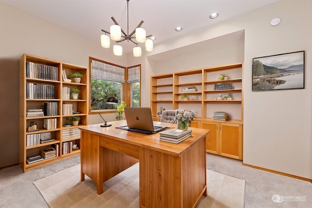 office with light colored carpet and a notable chandelier