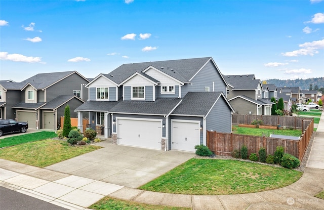 view of front of house featuring a front yard and a garage