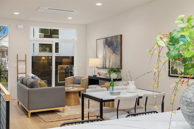 living room with light hardwood / wood-style flooring