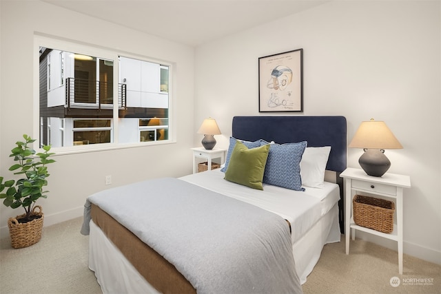 bedroom featuring light colored carpet