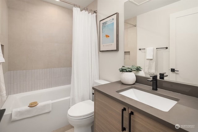 full bathroom with shower / bath combination with curtain, vanity, and toilet