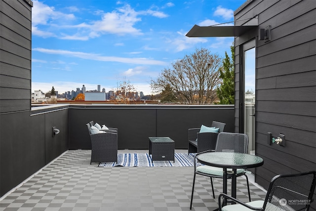 view of patio with a balcony