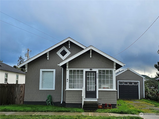 bungalow featuring a garage