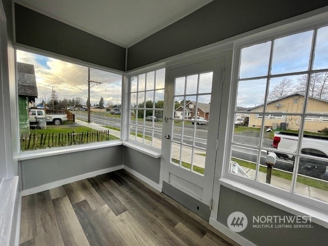 unfurnished sunroom featuring a healthy amount of sunlight