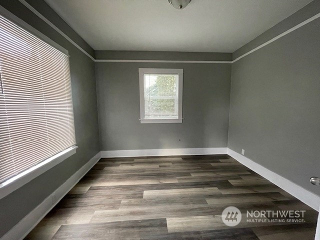 empty room with dark hardwood / wood-style floors