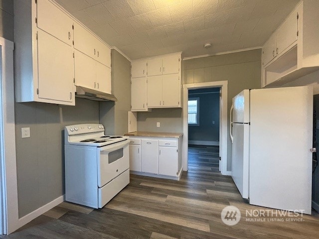 kitchen featuring white appliances, ornamental molding, dark hardwood / wood-style flooring, and white cabinets