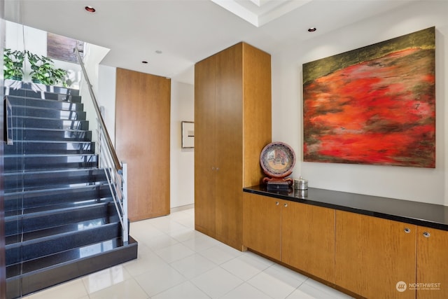 stairs with tile patterned flooring