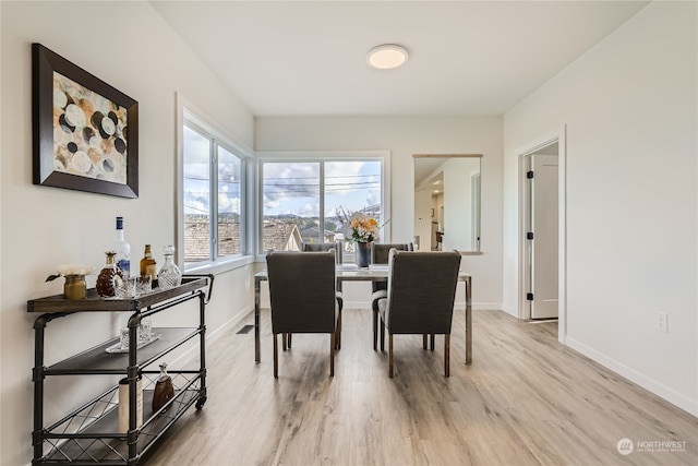 dining space featuring light hardwood / wood-style floors