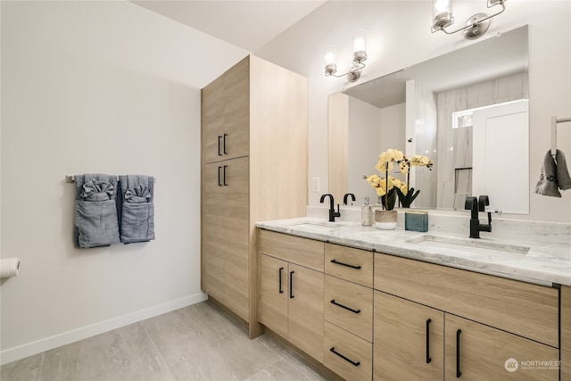 bathroom featuring vanity and tile patterned flooring