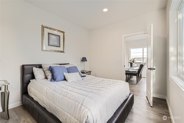 bedroom with light hardwood / wood-style flooring