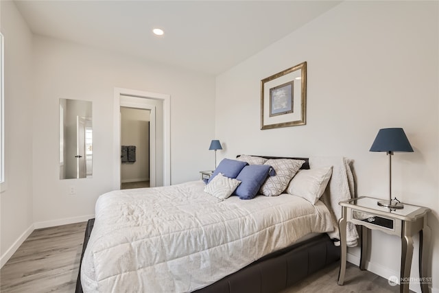 bedroom with light hardwood / wood-style floors