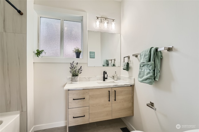 bathroom featuring vanity, shower / tub combination, and tile patterned flooring