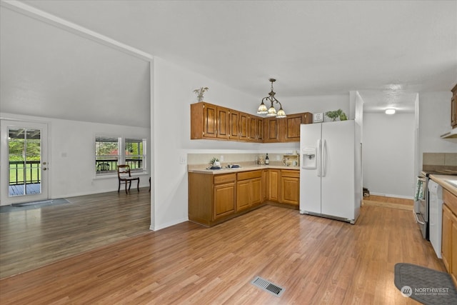 kitchen with stainless steel electric range oven, white refrigerator with ice dispenser, light hardwood / wood-style floors, lofted ceiling, and decorative light fixtures