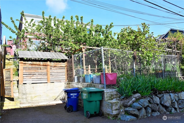 view of patio / terrace featuring a storage unit