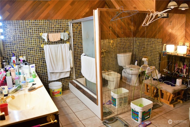 bathroom featuring vanity, tile walls, and tile patterned flooring