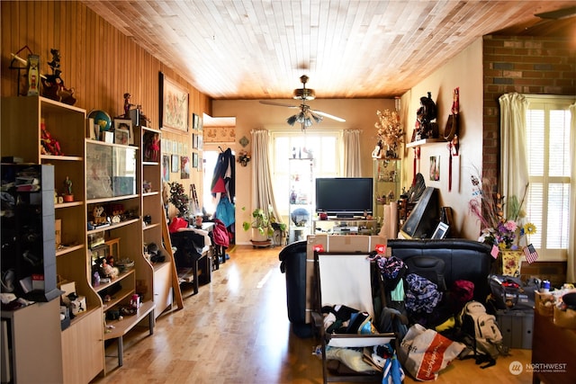 office space featuring light hardwood / wood-style floors, wooden ceiling, and ceiling fan