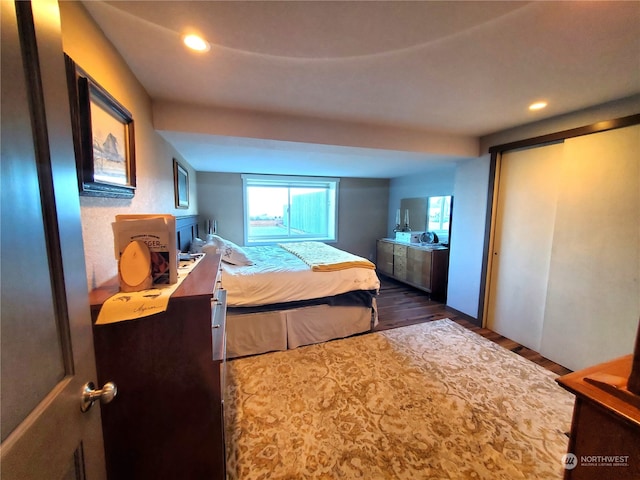 bedroom featuring dark wood-type flooring