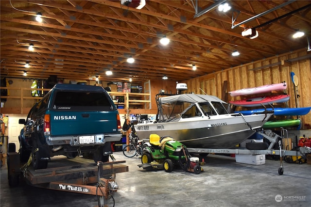 garage featuring wood walls