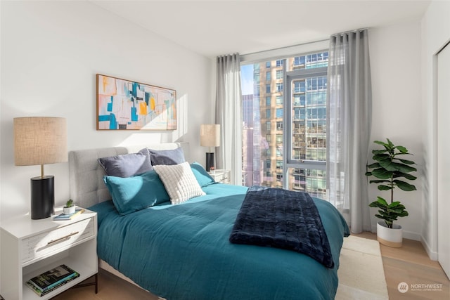 bedroom with light hardwood / wood-style floors